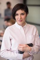 hispanic businesswoman with tablet at meeting room photo