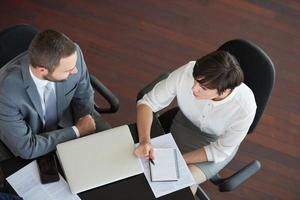 top view of business people group on meeting photo