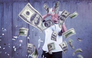 black businessman making the rain of money photo