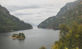 house on the island of ponds, lakes and fjord in Norway photo