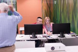 teacher and students in computer lab classroom photo