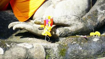 closeup hand of Buddha statue sculpture at temple in Sukhothai photo