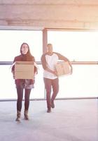 multiethnic business team carrying cardboard boxes photo