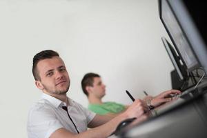 a group of graphic designers at work photo