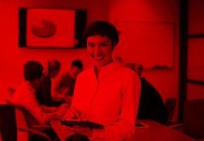 hispanic businesswoman with tablet at meeting room photo