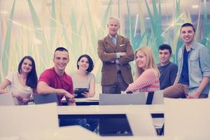 portrait of  teacher with students group in background photo