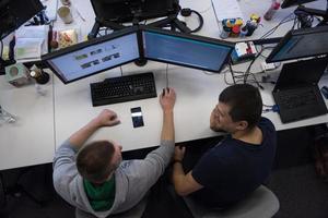 young programmers writing programming code top view photo