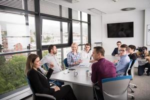 Group of young people meeting in startup office photo