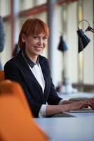 business woman working on computer at office photo