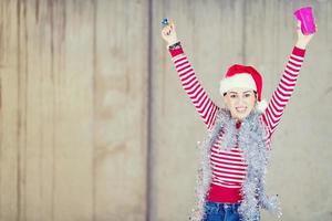 young business woman wearing a red hat and blowing party whistle photo