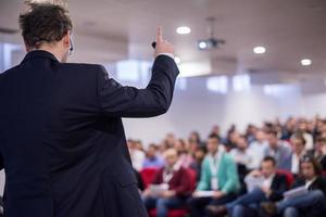 successful businessman giving presentations at conference room photo