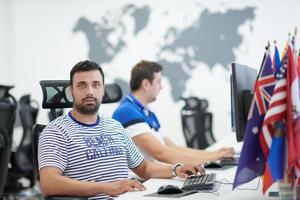 two male software developers working on computer photo