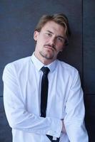 portrait of startup businessman in a white shirt with a tie photo