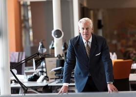 portrait of handsome senior business man at modern office photo