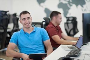 two male software developers working on computer photo
