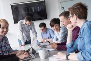 Group of young people meeting in startup office photo