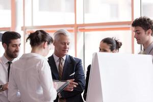 young startup businessman making presentation to senior investior photo