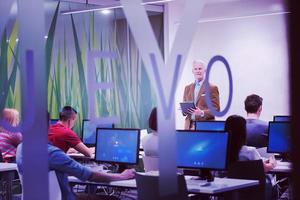 teacher and students in computer lab classroom photo