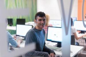 technology students group working  in computer lab school  classroom photo