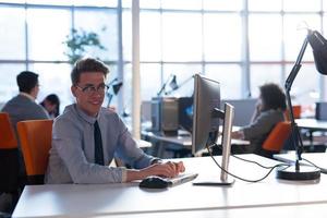 businessman working using a computer in startup office photo