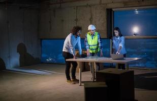 business people in group, architect and engineer on construction site photo