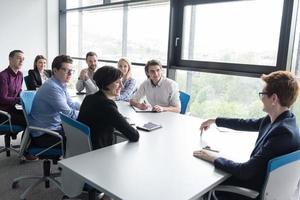 Group of young people meeting in startup office photo