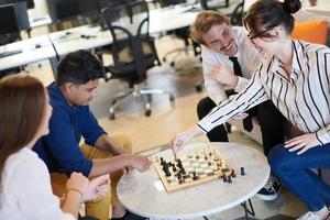 multiethnic group of business people playing chess photo