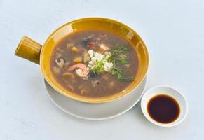 Braised Fish Maw in Red Gravy with Crab and shrimp in bowl photo