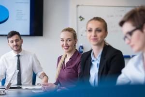 young business people group on team meeting at modern office photo