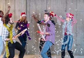 multiethnic group of casual business people having confetti party photo