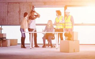 group of multiethnic business people on construction site photo