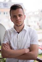 man standing at balcony photo