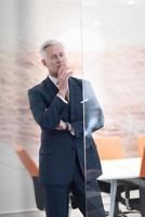 portrait of handsome senior business man at modern office photo