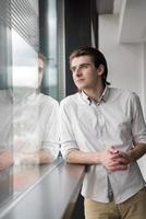 young businessman in startup office by the window photo