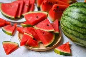 Closeup sweet watermelon slices pieces fresh watermelon tropical summer fruit, Watermelon slice on wooden background photo