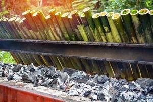 glutinous rice roasted in bamboo joints thai dessert with sticky rice soaked in coconut milk photo