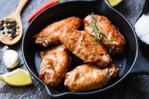 Baked chicken wings with sauce and herbs and spices cooking thai asian food rosemary chicken grilled photo