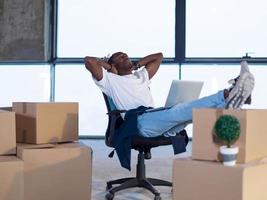 young black male architect taking a break on construction site photo