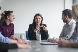 Group of young people meeting in startup office photo