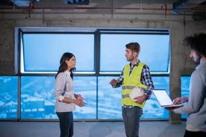 business people in group, architect and engineer on construction site photo