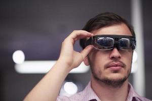 man using virtual reality gadget computer glasses photo