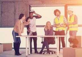 group of multiethnic business people on construction site photo