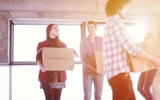 business team carrying cardboard boxes photo