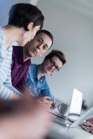 Group of young people meeting in startup office photo