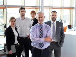 senior business man with his team at office photo