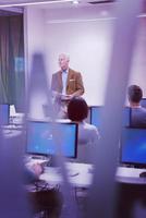 teacher and students in computer lab classroom photo