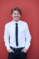 portrait of startup businessman in front of pink wall photo