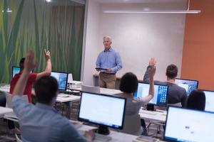 teacher and students in computer lab classroom photo