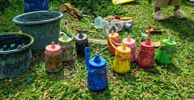 painting paint bottles being prepared at a painting event in a park photo