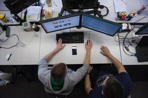 young programmers writing programming code top view photo